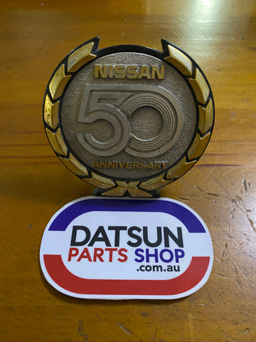 Nissan 50 Anniversary Badge Die Cast Used
