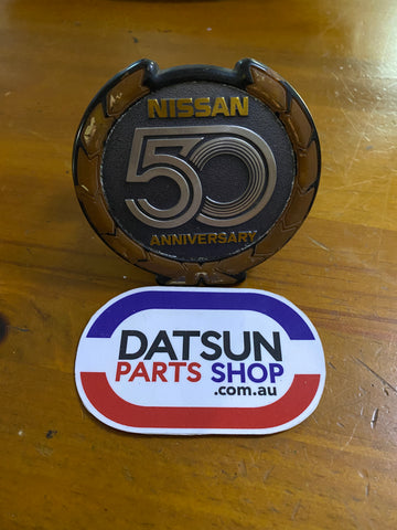 Nissan 50 Anniversary Badge Plastic Used