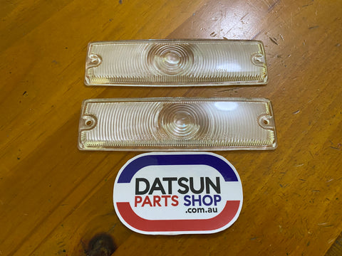 Datsun 1000 B10 Early Front Light Lens Pair NOS