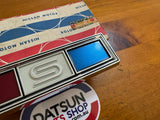 Datsun 1000 Coupe KB10 Grill Badge NOS