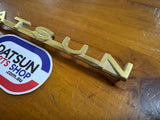 Datsun 411 Badge Used