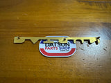 Datsun 411 Badge Used