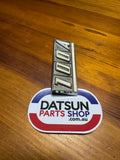 Datsun Cherry 100A Badge Used 84823-M0903 Nissan.