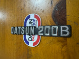 Datsun 200B Boot Badge Genuine Nos 810