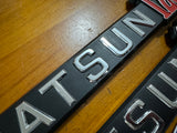 Datsun 120Y Coupe Side Badge Pair Nos Genuine Vb210