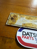 Datsun 410, 411 Radio Blank Plate Badge Used