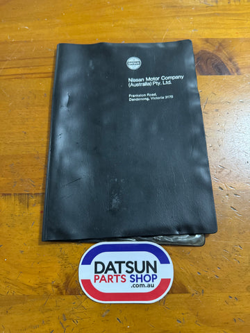 Datsun Owners Manual Folder Used Nissan (small rip)