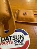 Datsun B310 Sunny Tan Escutcheon Pair Used