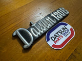 Datsun 180B 1/4 Panel Badge Used 610 (missing pin)