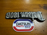 Datsun 180B 1/4 Panel Badge Used 610 (missing pin)