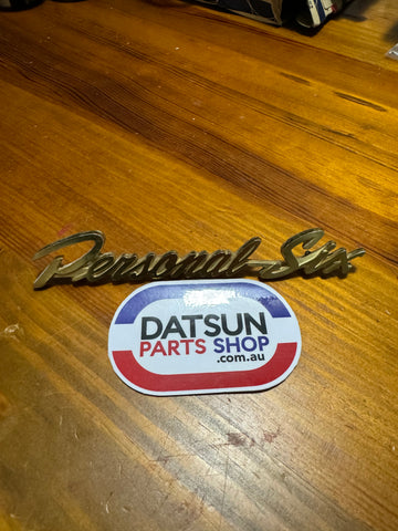 Datsun Nissan Personal Six Badge H130